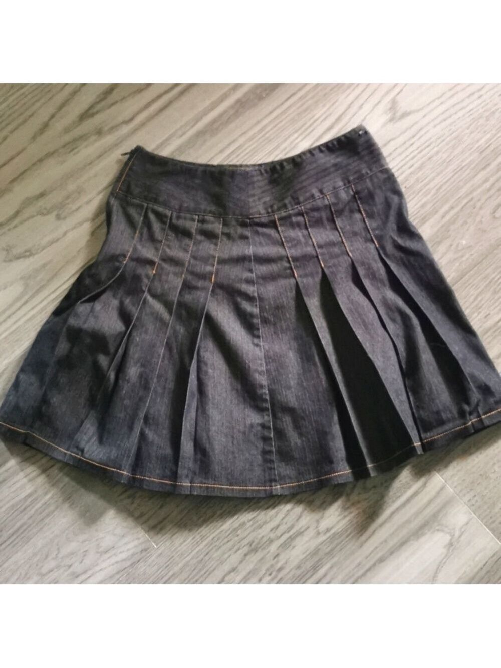 San Francisco mini pleated black denim skirt.
